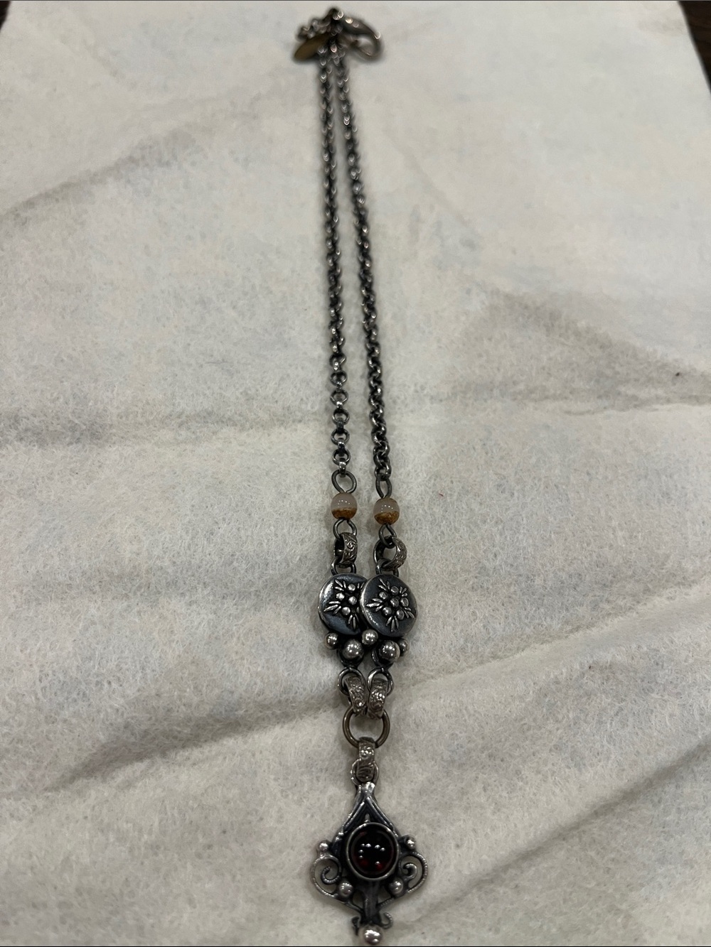 Blackened Silver Floral Pendant Necklace with Dark Red Stone